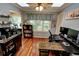 Bright office with a desk setup, a window with wooded views, and shelving at 36 Saint Claire Ne Ln, Atlanta, GA 30324