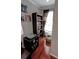 Cozy nook with a dark wood bookshelf, record player, and bright window with sheer curtains at 36 Saint Claire Ne Ln, Atlanta, GA 30324