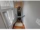 Carpeted staircase with natural lighting from window, paneled feature, and black railing at 36 Saint Claire Ne Ln, Atlanta, GA 30324