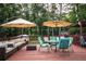 A spacious back deck is furnished with outdoor seating and tables at 3829 Bright Star Road Rd, Douglasville, GA 30135