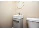 A close-up of a modern sink and toilet in a half bathroom at 3829 Bright Star Road Rd, Douglasville, GA 30135