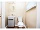 A well-lit half bathroom features a modern sink and toilet at 3829 Bright Star Road Rd, Douglasville, GA 30135