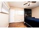 A cozy bedroom featuring a mounted TV and fireplace at 3829 Bright Star Road Rd, Douglasville, GA 30135