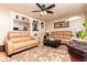 Inviting living room with a ceiling fan, hardwood floors, and tan sofas at 3829 Bright Star Road Rd, Douglasville, GA 30135