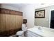 Bathroom featuring a shower, a commode, and a single-sink vanity at 704 Olde Mill Ln, Norcross, GA 30093