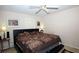 Comfortable bedroom featuring a ceiling fan and natural light at 704 Olde Mill Ln, Norcross, GA 30093