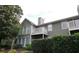 Side view of a home with siding, white trim, and a deck at 704 Olde Mill Ln, Norcross, GA 30093