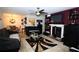 Cozy living room featuring a fireplace, dark furniture, and modern lighting at 704 Olde Mill Ln, Norcross, GA 30093