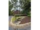 Pathway with steps leading to building. Well-manicured landscaping enhances community at 704 Olde Mill Ln, Norcross, GA 30093