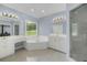 Bright bathroom with double sink vanity, garden tub, and glass enclosed shower at 718 First Cotton Dr, Powder Springs, GA 30127