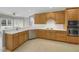 Spacious kitchen with light wood cabinets, white countertops and stainless steel appliances at 718 First Cotton Dr, Powder Springs, GA 30127