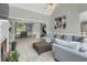 Spacious living room with high ceilings, fireplace, and open view to dining and bonus rooms at 718 First Cotton Dr, Powder Springs, GA 30127