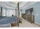 Comfortable main bedroom offers a sitting area, king bed, and TV at 718 First Cotton Dr, Powder Springs, GA 30127