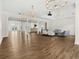 Spacious ballroom with wood floors, columns, and neutral decor at 9745 Autry Falls Dr, Alpharetta, GA 30022
