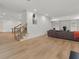 Expansive basement with hardwood floors, neutral walls, stairs and offering plenty of space for recreation at 9745 Autry Falls Dr, Alpharetta, GA 30022