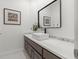 A modern bathroom vanity features dark wood cabinets, a white countertop, and a rectangular sink at 9745 Autry Falls Dr, Alpharetta, GA 30022