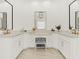 Elegant bathroom with double vanity, marble countertops, and ample storage space at 9745 Autry Falls Dr, Alpharetta, GA 30022