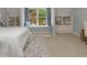 Bedroom featuring a window seat, built-in shelves, and a comfortable bed at 9745 Autry Falls Dr, Alpharetta, GA 30022