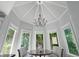 Charming breakfast nook features a round table, patterned chairs, and lots of windows at 9745 Autry Falls Dr, Alpharetta, GA 30022