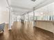Large clubhouse event space with wooden floors, columns, and counter area at 9745 Autry Falls Dr, Alpharetta, GA 30022