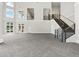 Open event space with high ceilings, railings, modern staircase, and large windows at 9745 Autry Falls Dr, Alpharetta, GA 30022