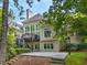 Exterior of home with a beautiful two-level deck and a well-manicured backyard at 9745 Autry Falls Dr, Alpharetta, GA 30022