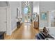 Grand foyer with hardwood floors, high ceilings, elegant decor, and view into the formal living spaces at 9745 Autry Falls Dr, Alpharetta, GA 30022