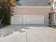 Attached two car garage, offering convenience and ample space for parking and storage at 9745 Autry Falls Dr, Alpharetta, GA 30022