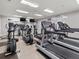 Gym with cardio equipment, mirrors, and ceiling fans at 9745 Autry Falls Dr, Alpharetta, GA 30022