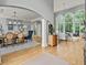 Bright living room and dining area with large windows and hardwood floors, perfect for entertaining at 9745 Autry Falls Dr, Alpharetta, GA 30022