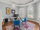 Inviting office with hardwood floors, modern furniture, and bright light from large windows at 9745 Autry Falls Dr, Alpharetta, GA 30022
