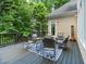 Outdoor deck area featuring comfortable seating and a pleasant view of the landscaped surroundings at 9745 Autry Falls Dr, Alpharetta, GA 30022