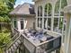 A beautiful deck area with stylish seating, a grill, and a fire pit, perfect for outdoor entertaining at 9745 Autry Falls Dr, Alpharetta, GA 30022