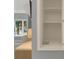 Built in open storage nook adjacent to bedroom with window seat at 9745 Autry Falls Dr, Alpharetta, GA 30022
