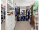 Spacious walk-in closet with custom shelving and ample storage space for clothes and accessories at 9745 Autry Falls Dr, Alpharetta, GA 30022
