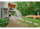 Backyard featuring a patio, green lawn, steps, and landscaped garden at 1290 Magnolia Park Cir, Cumming, GA 30040
