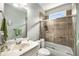 Bathroom with shower, bathtub, window, and sink at 1290 Magnolia Park Cir, Cumming, GA 30040
