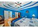 Spacious bedroom featuring vibrant blue walls and hardwood floors at 1290 Magnolia Park Cir, Cumming, GA 30040