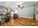 Charming bedroom with hardwood floors, desk, and a ceiling fan at 1290 Magnolia Park Cir, Cumming, GA 30040