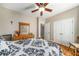 Bedroom with a ceiling fan and hardwood floors at 1290 Magnolia Park Cir, Cumming, GA 30040