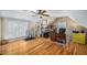 Spacious bedroom with hardwood floors, natural light, and ample space for exercise equipment at 1290 Magnolia Park Cir, Cumming, GA 30040