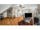 Bright bedroom featuring hardwood floors, ceiling fan, and neutral wall color at 1290 Magnolia Park Cir, Cumming, GA 30040