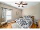 Cozy bedroom with a ceiling fan and hardwood floors at 1290 Magnolia Park Cir, Cumming, GA 30040