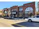 Street-level view of retail businesses and restaurants in the city center at 1290 Magnolia Park Cir, Cumming, GA 30040