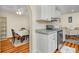Charming eat-in kitchen with wood floors, stainless steel appliances, and granite countertops at 1290 Magnolia Park Cir, Cumming, GA 30040