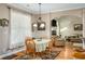 Charming dining area with hardwood floors, neutral colors, and an open connection to the adjacent living space at 1290 Magnolia Park Cir, Cumming, GA 30040