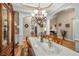 Elegant dining room featuring a chandelier, china cabinet, and hardwood floors at 1290 Magnolia Park Cir, Cumming, GA 30040