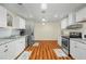 Well-lit kitchen featuring granite countertops, stainless steel appliances and wood flooring at 1290 Magnolia Park Cir, Cumming, GA 30040