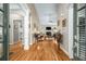 Spacious living room with hardwood floors, fireplace, and an open view to the entrance at 1290 Magnolia Park Cir, Cumming, GA 30040