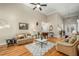 Open concept living room with hardwood flooring, neutral tones, plenty of seating, and natural light at 1290 Magnolia Park Cir, Cumming, GA 30040